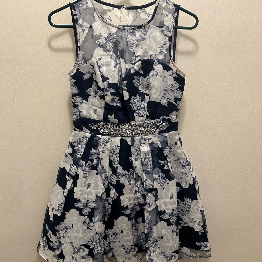 Semi formal dress with embellished waistline and illusion neck.